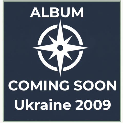 Dark slate-blue compass placeholder graphic for the Ukraine 2009 travel photography album on Trekker.Space.
