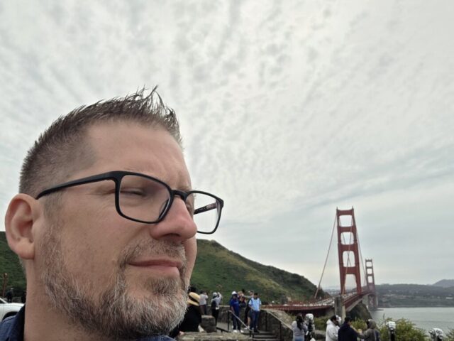 Jason Payne standing in front of the Golden Gate Bridge during the San Francisco 2026 trek.