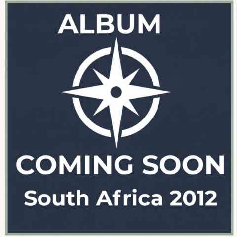 Dark slate-blue compass placeholder graphic for the South Africa 2012 cross-cultural travel photography album on Trekker.Space.